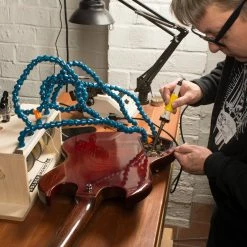 StewMac Solder Monster - StewMac -Strings + Accessories Shop 0531 3 monster in use 3000px