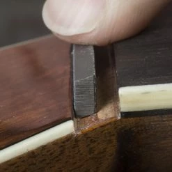 Angled Nut Seating File For Martin - StewMac -Strings + Accessories Shop 5074 3 angled20file20in20use201203000jpg